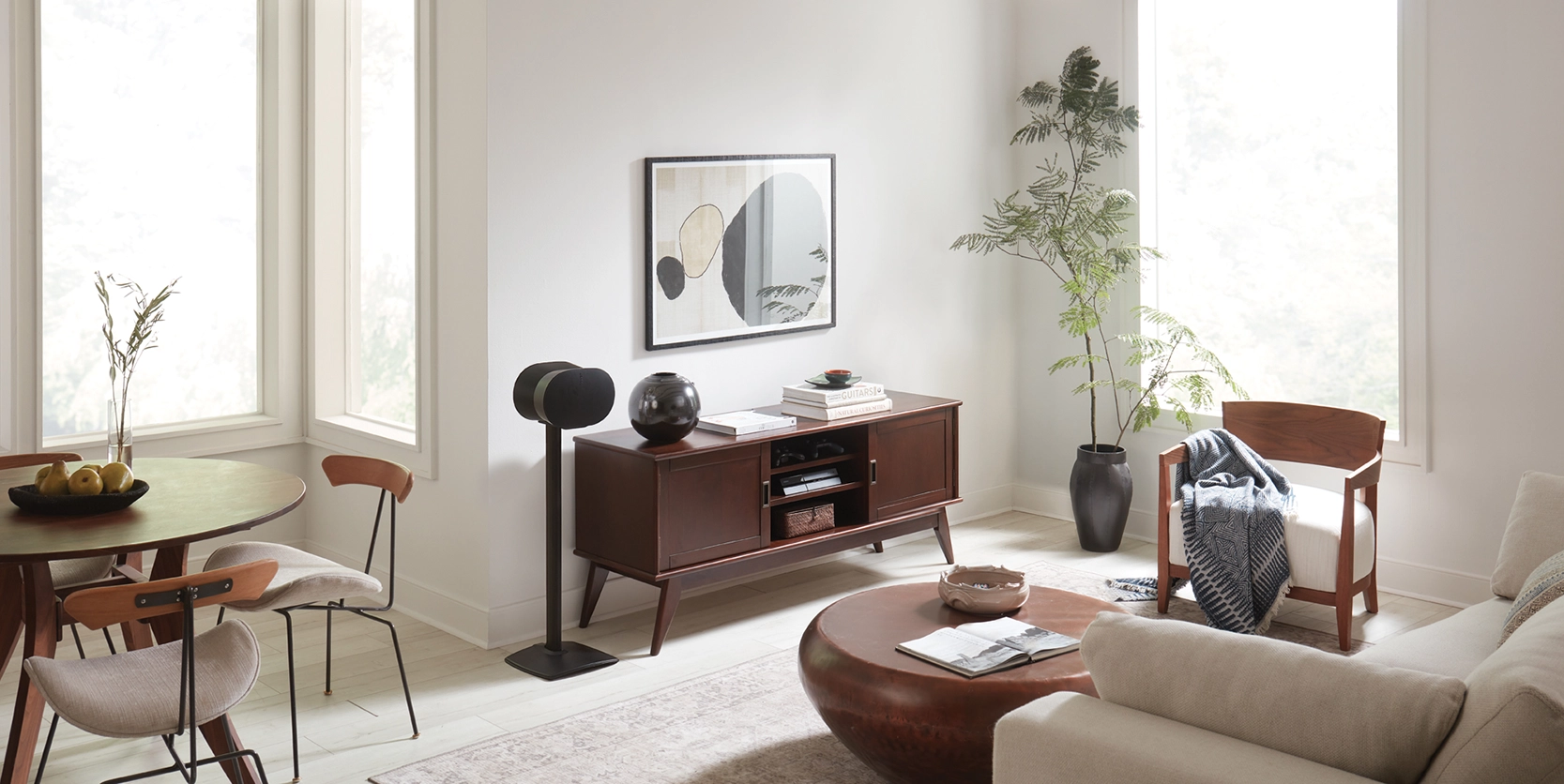 Lifestyle shot featuring WSSE31 Fixed-Height Speaker Stands in black
