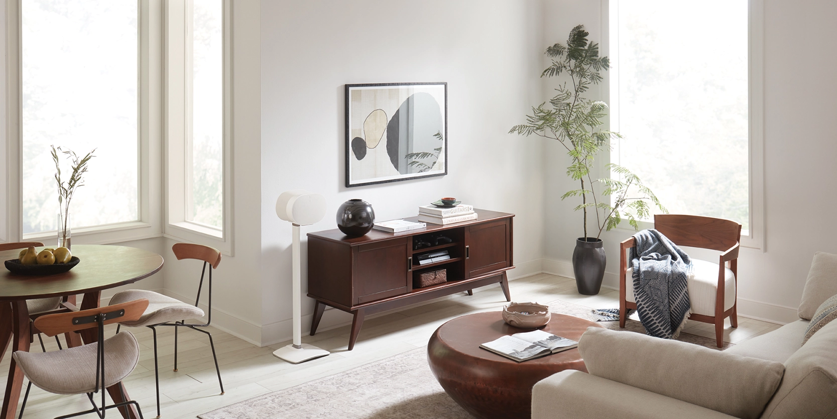 Lifestyle shot featuring WSSE31 Fixed-Height Speaker Stands in white